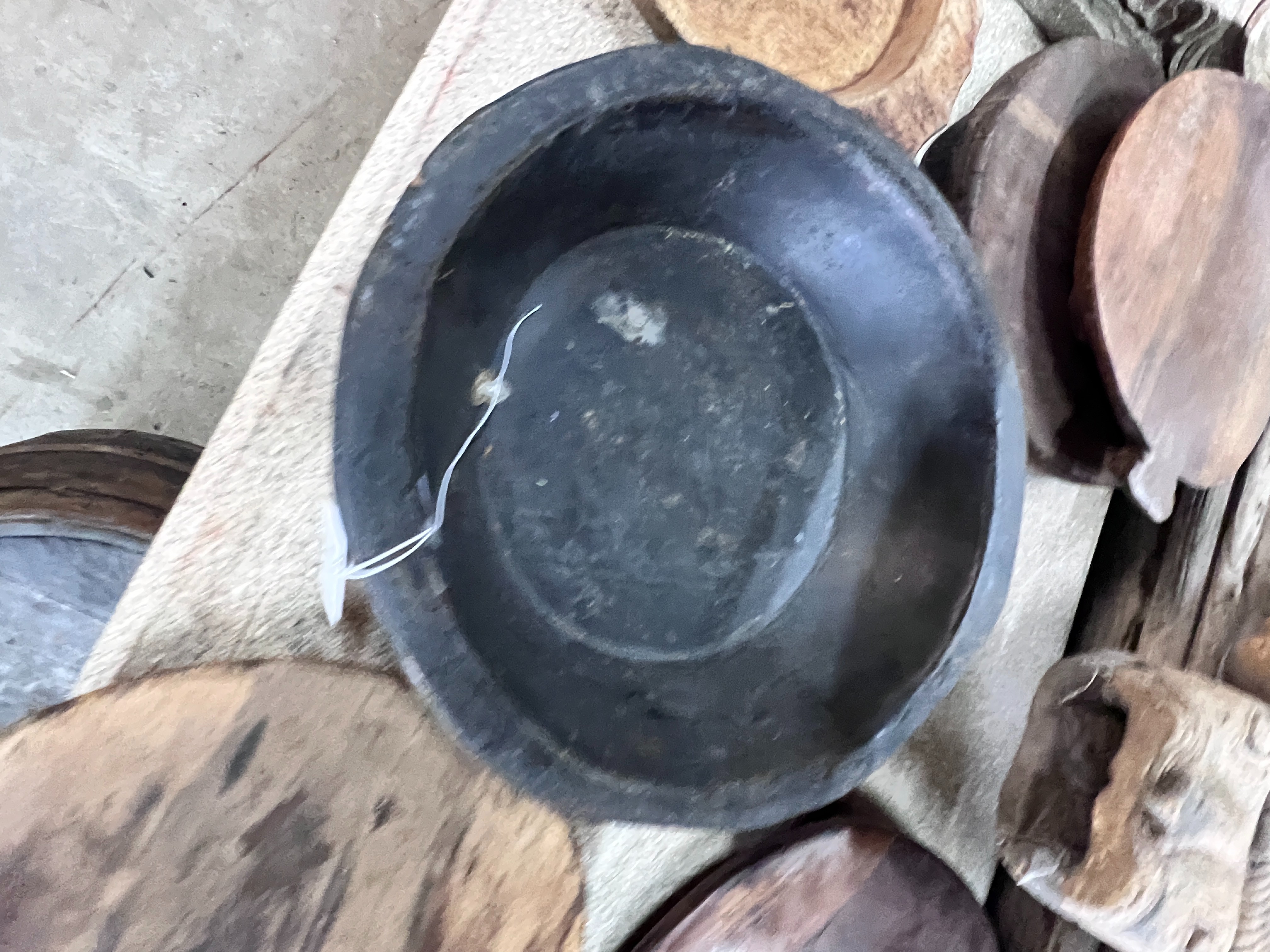 Two wood mazers and five wood trivets, largest diameter 38cm